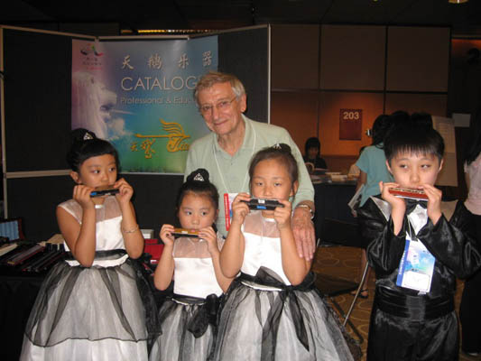 Young harmonica players in competition outfits at the Singapore festival