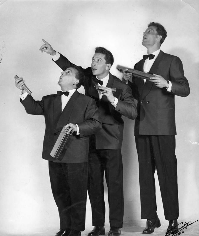 The Raisner Trio in dinner jackets, harmonicas in hand, studio photo