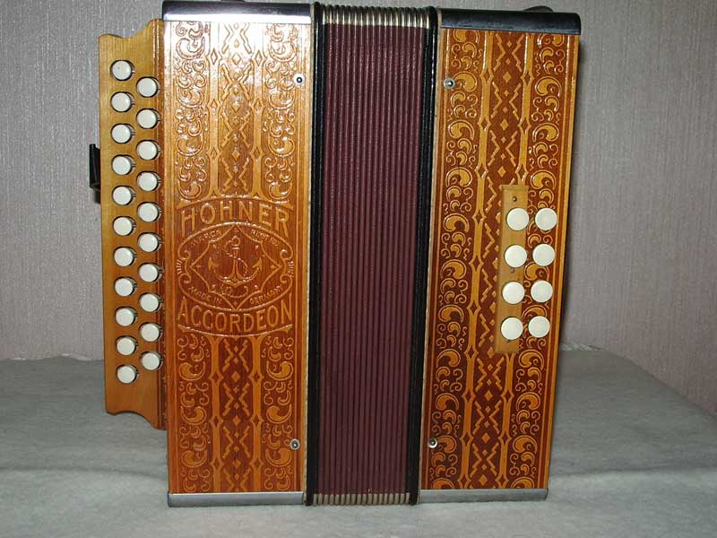 Hohner diatonic button accordion with decorated wooden panels