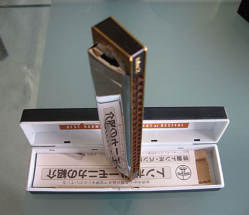 Tombo harmonica standing in its open case
